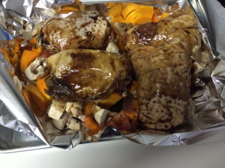 marinade sauce poured over chicken and vegetables