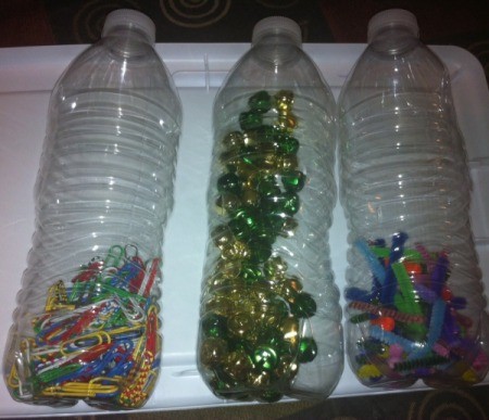 Magnetic Discovery Bottles - add cut up pipe cleaners, bells, and paper clips to each of three bottles, one type of inclusion per bottle