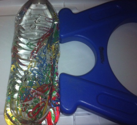 Magnetic Discovery Bottles - water filled bottle with paper clips
