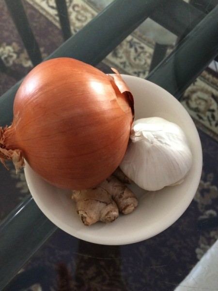 An onion, garlic and gingerroot, for pho.