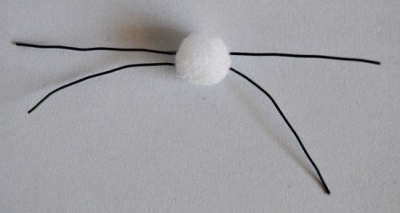 Upcycled Easter Bunny Craft - add glue to broom bristles and push into white pom pom to make whiskers