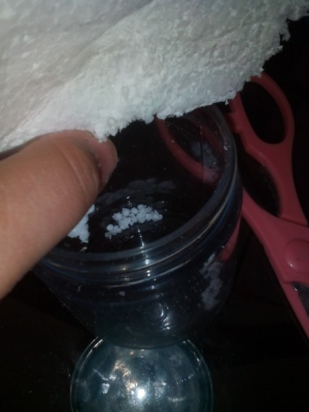 Easy Snow Globe  - rubbing the Styrofoam apart for the snow