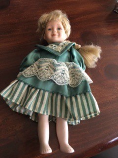 Identifying Doll Manufacturer - small doll with blond hair and green and white dress