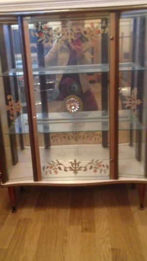 Value of Glass Front Cabinet - glass fronted cabinet with decorations on doors and mirrored back