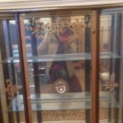 Value of Glass Front Cabinet - glass fronted cabinet with decorations on doors and mirrored back