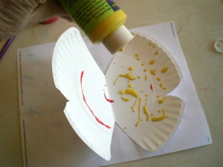 Make a Spring Butterfly from a Paper Plate - unfold and drip paint on one side of plate