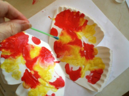 Make a Spring Butterfly from a Paper Plate - use brush to add details