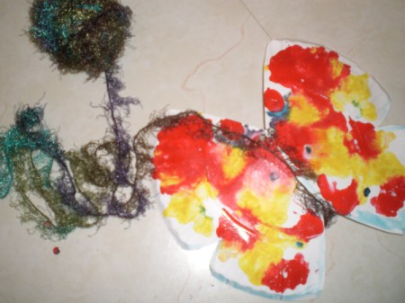 Make a Spring Butterfly from a Paper Plate - add pipe cleaner under yarn and shape for antenna