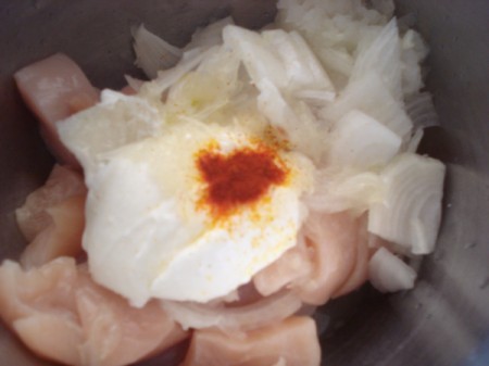chicken, onions, and spices to marinate