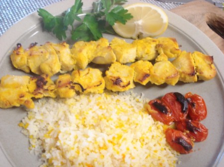 Chicken Kabobs, tomatoes and rice on plate