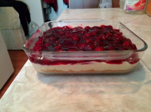 A no bake cherry cheesecake in a sheet pan.