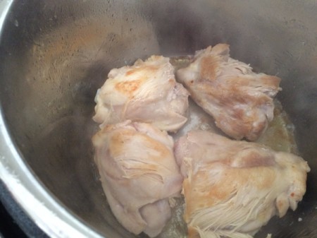 Chicken pieces in the pressure cooker.