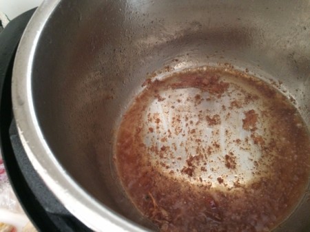 Browned bits in the bottom of the pressure cooker.