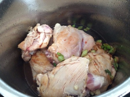 Chicken and sauce in the pressure cooker.