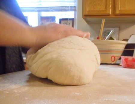 Bread dough being kneaded.