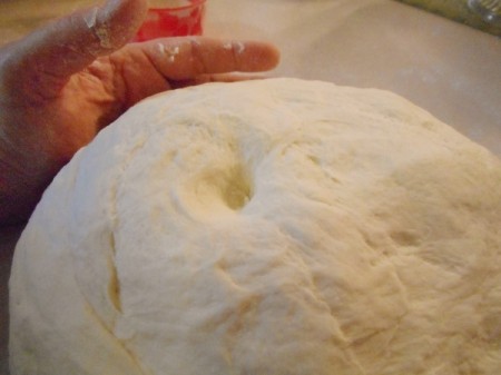 Bread dough being kneaded.