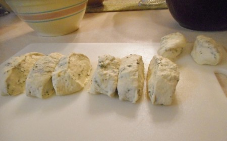 Cut pieces of herb bread dough.