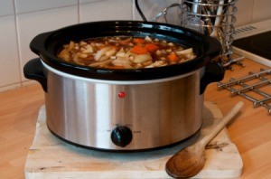 A pot of soup in a slow cooker.