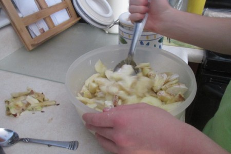 Mixing apples.
