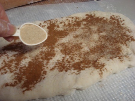 sprinkling sugar in dough