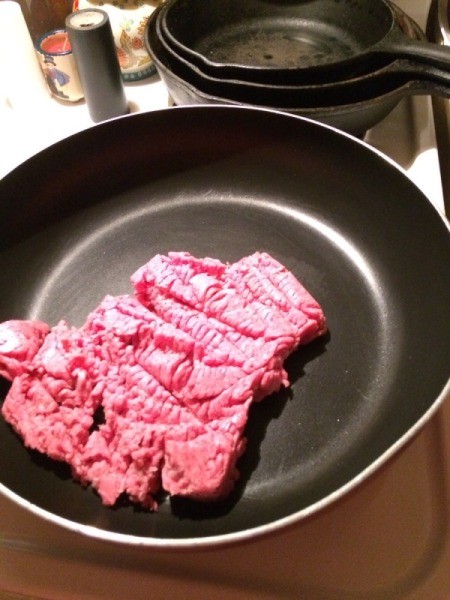 raw ground beef in skillet