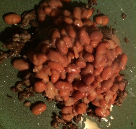 beans added to ground beef on plate