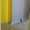 Decorating a Small Foyer bright yellow wall and light grey one