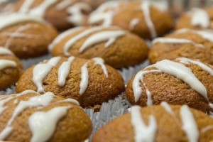 A cream cheese glaze on top of muffins.