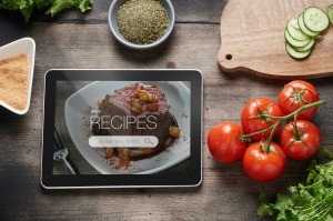 A tablet with recipe software showing on the screen.