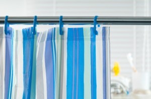 A blue striped shower curtain.