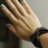 DIY Leather Bow Bracelet - woman's hand and wrist with bracelet on
