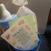 The contents of a baby shower gift, placed in a reusable pail.