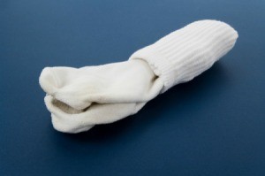A pair of white socks on a blue background.