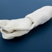 A pair of white socks on a blue background.