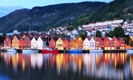 Houses reflected in the water in Norway.