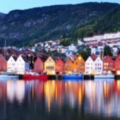 Houses reflected in the water in Norway.