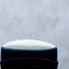 A white stick deodorant with the lid off.