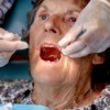 A woman receiving dental care.