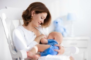 A woman breastfeeding her infant son.