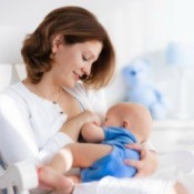 A woman breastfeeding her infant son.