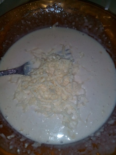 adding cheese to flour mixture