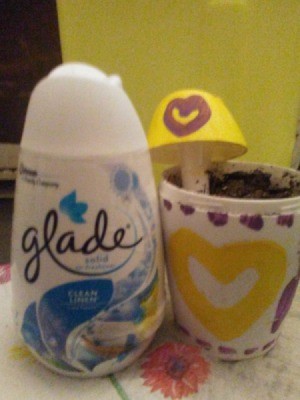 A planter made from a Glade air freshener.