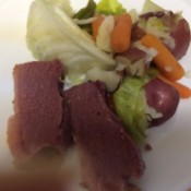 A plate of corned beef and cabbage.