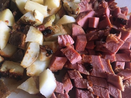 Corned beef hash being prepared.