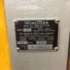 The serial number and manufacturer's tag on a Wurlitzer juke box.