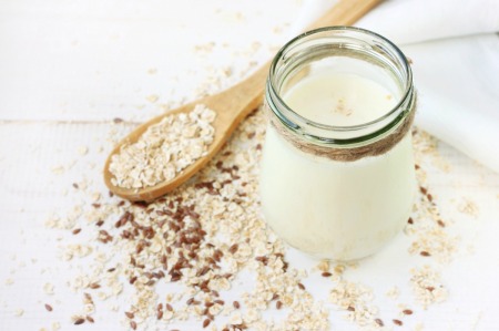 Oats and yogurt on a white background.