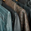A row of leather jackets hanging up.
