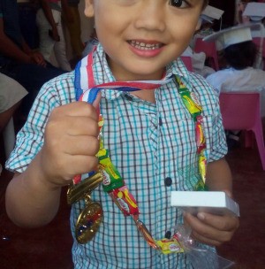 Candy Garland - happy little boy wearing his candy garland