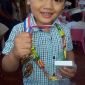 Candy Garland - happy little boy wearing his candy garland