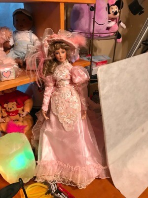 Identifying a Porcelain Doll - doll in fancy 1890s style pink dress